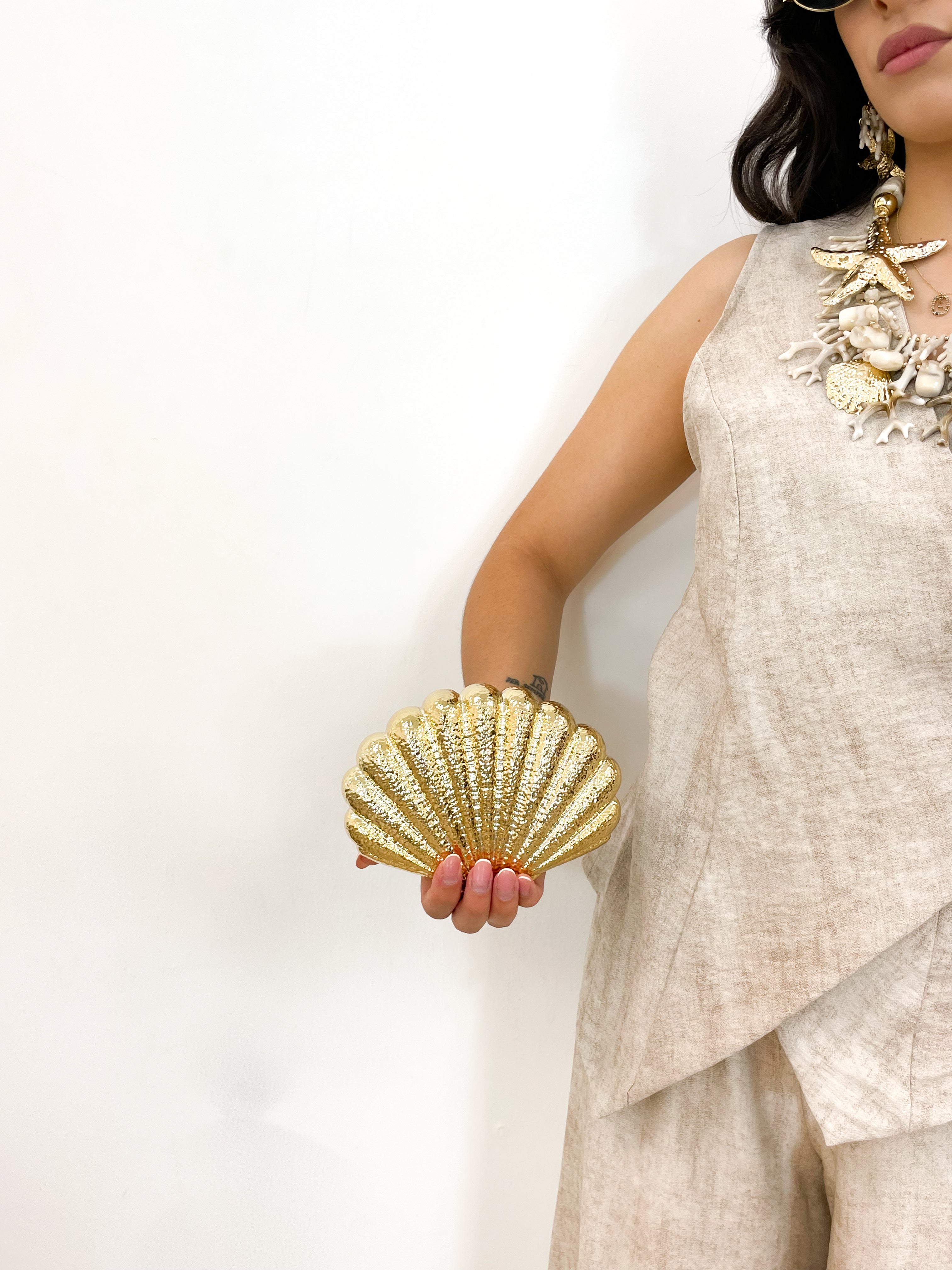 Clutch conchiglia oro